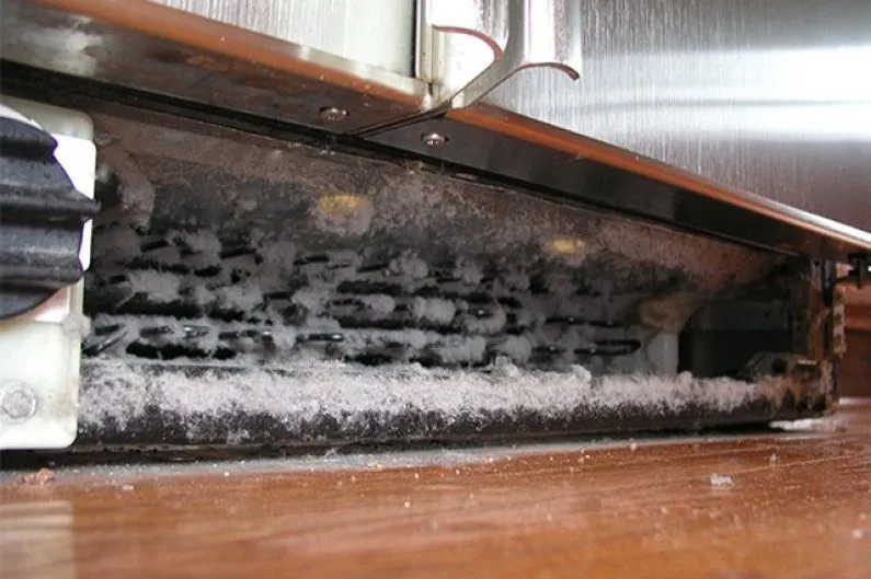 Clean Refrigerator Coils in Models with Hidden Reach Coils